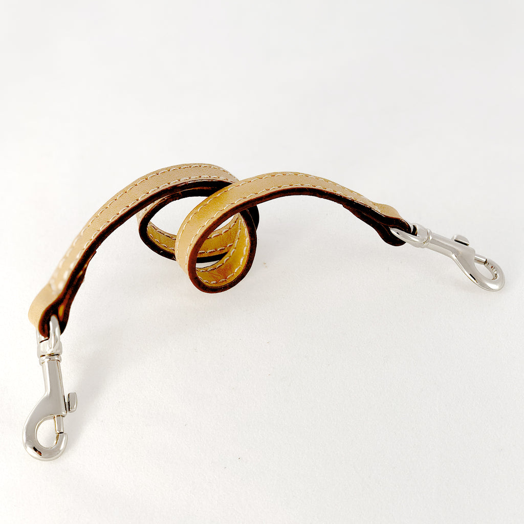 Leather key lanyard in saddle tan coiled